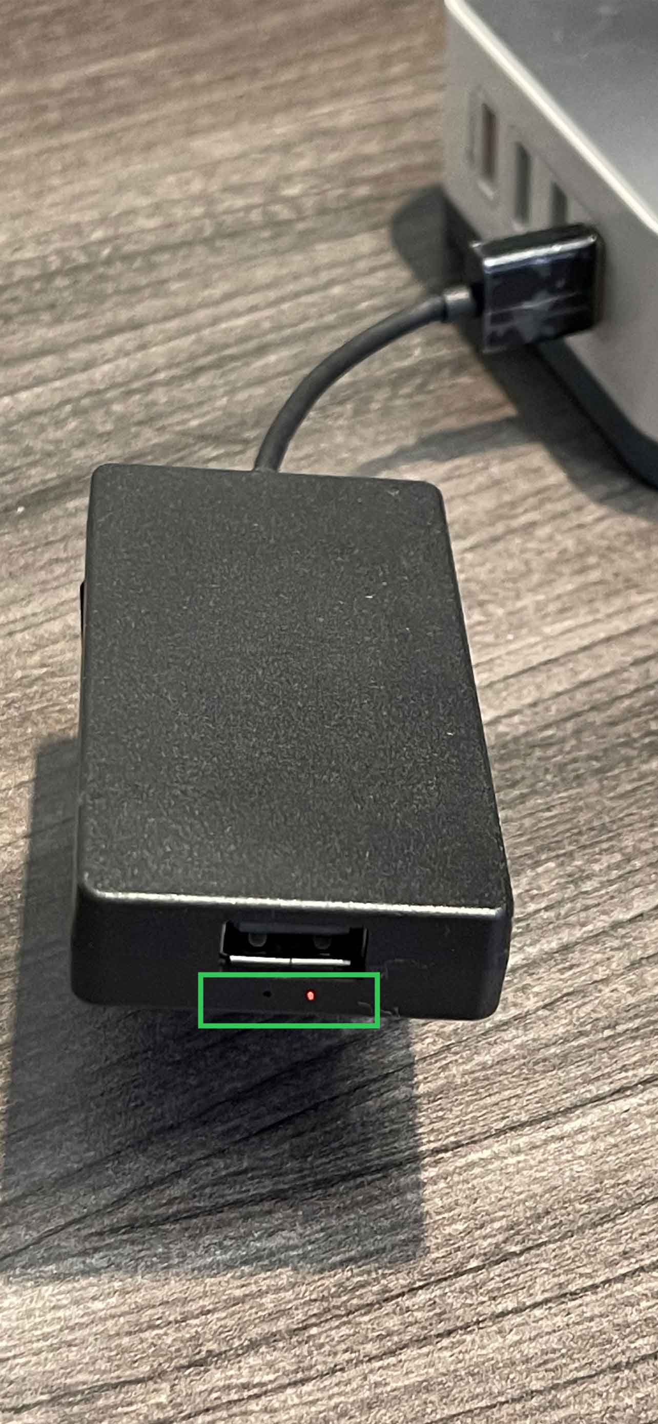 AACP dongle with red LED lit, indicating it is ready